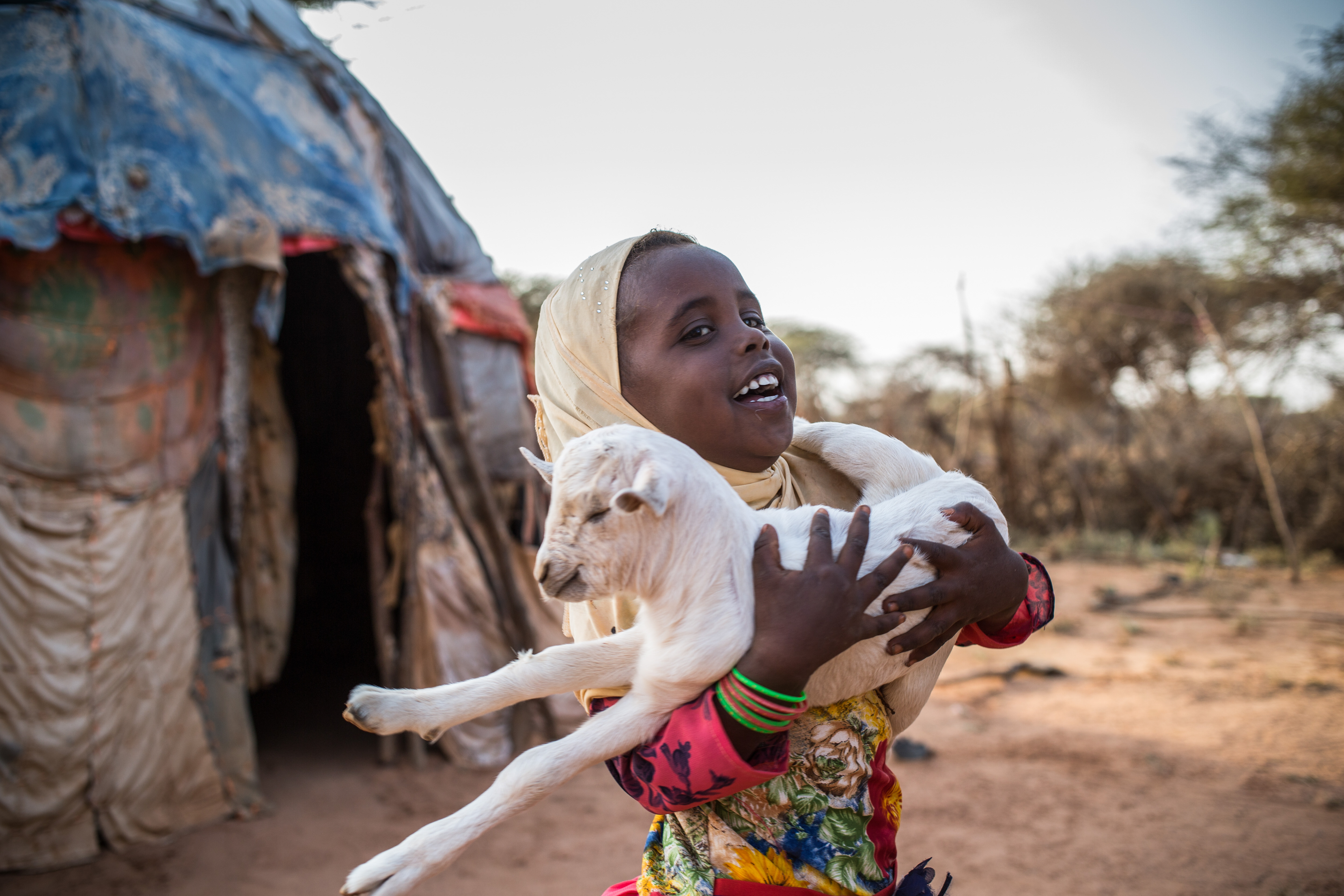 Photo of child with goat