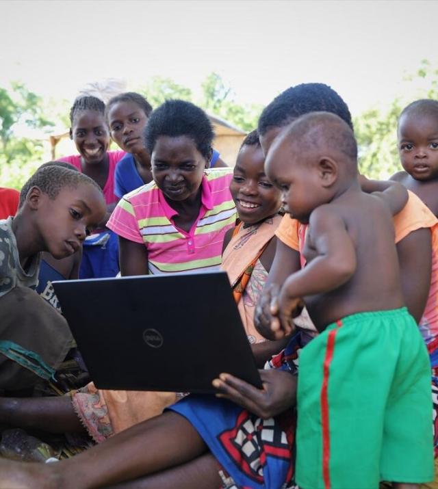 photo of a family using a laptop